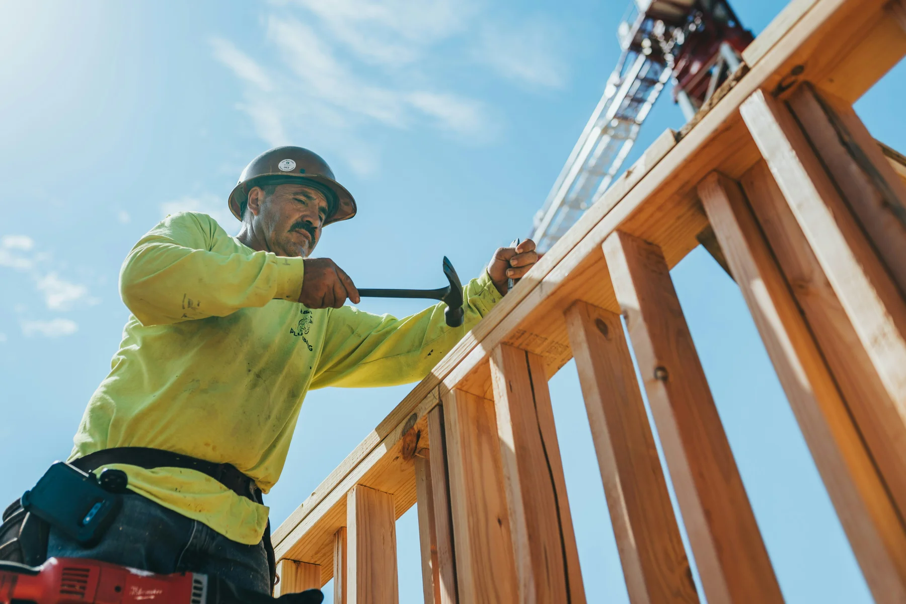 A construction professional working on timber framing